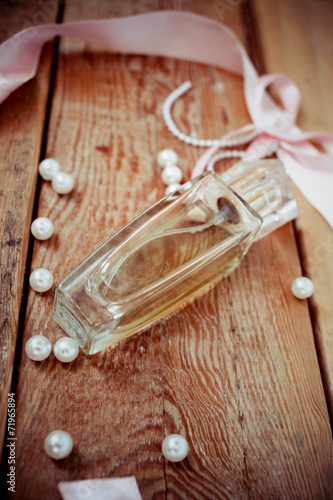perfume bottles on the wooden background