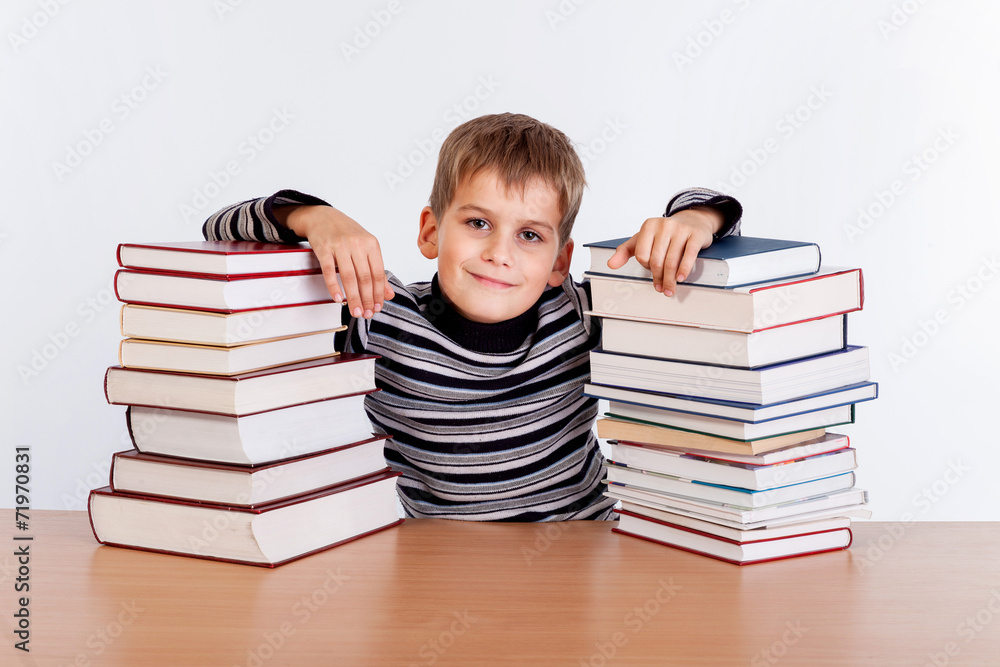 Schoolboy and a heap of books Schoolboy and a heap of books