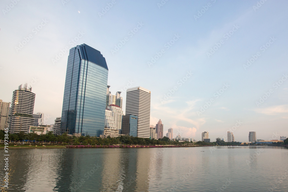 Fototapeta premium Benjakiti park city downtown with water reflection, Bangkok,Thailand