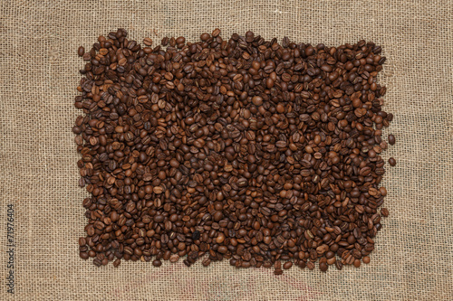 Coffee beans on a jute background