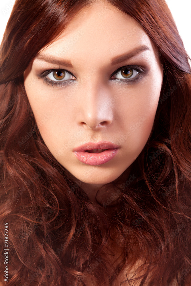 Portrait of young woman with red hair