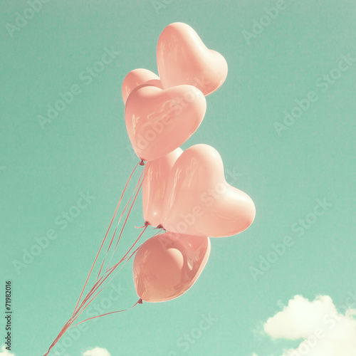 Bunch of pink heart-shaped balloons photo