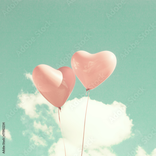 Two pink heart-shaped balloons