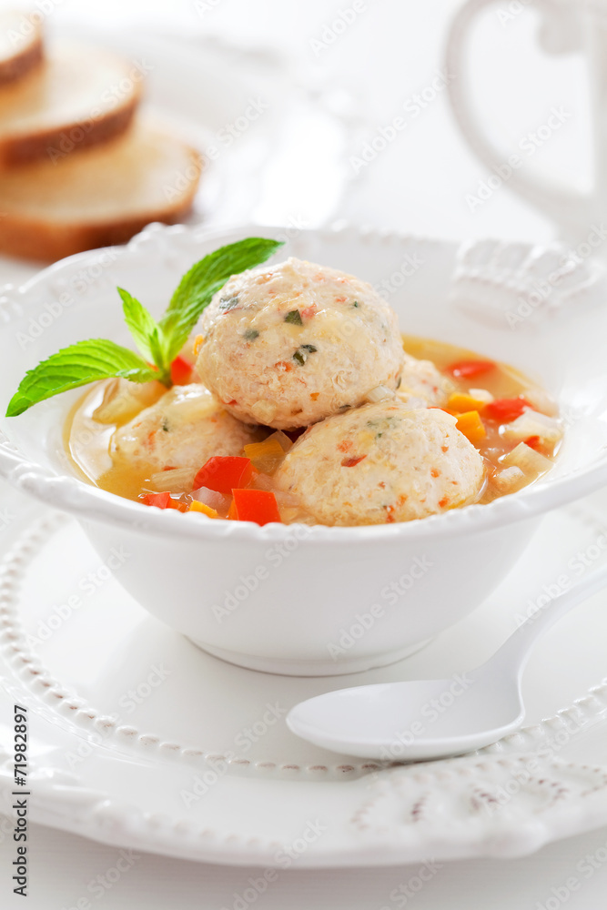 Soup with chicken meatballs and vegetables, selective focus Soup with chicken meatballs and vegetables, selective focus