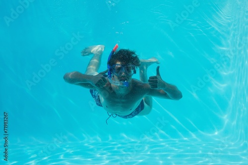 Man underwater gesturing thumbs up