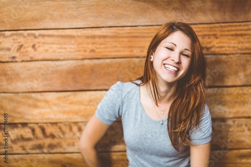 Portrait of a cheerful pretty redhead laughing