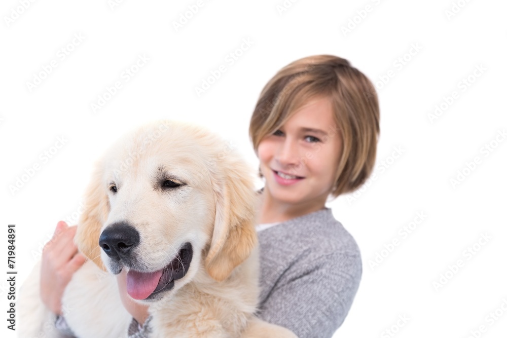 Portrait of cute boy carrying his dog