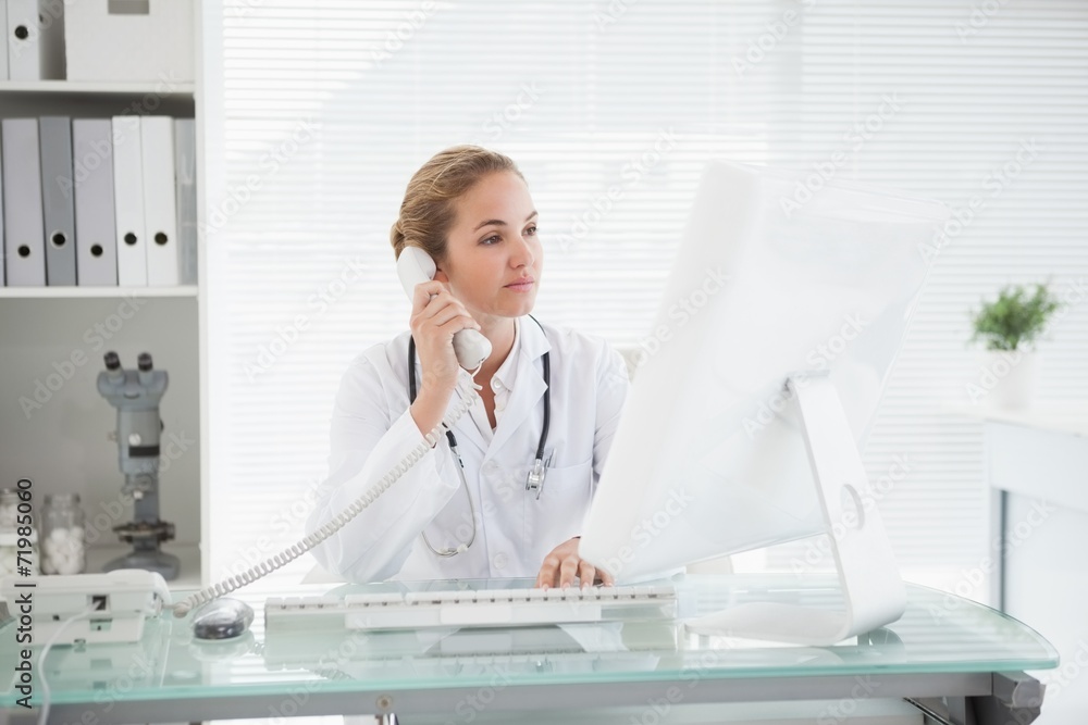 Doctor taking a phone call Doctor taking a phone call