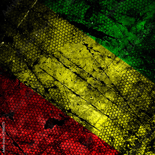 Red, yellow, green rasta flag on grunge textured concrete wall photo