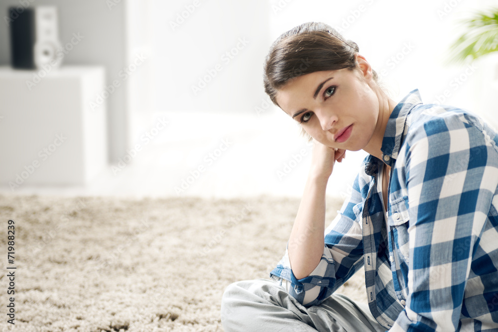 Attractive woman sitting on the floor Attractive woman sitting on the floor