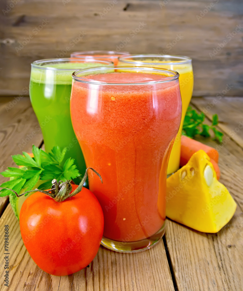 Juice tomato and vegetables in glasses on board Juice tomato and vegetables in glasses on board