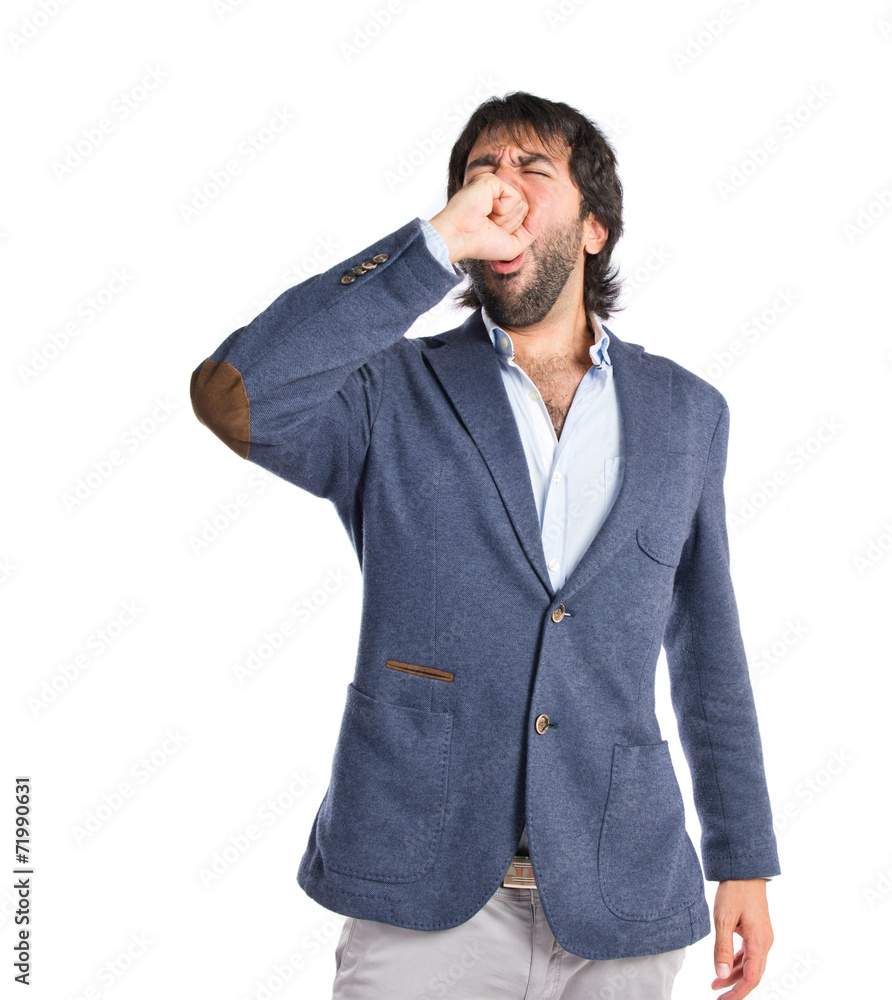 Man yawning over isolated white background Man yawning over isolated white background