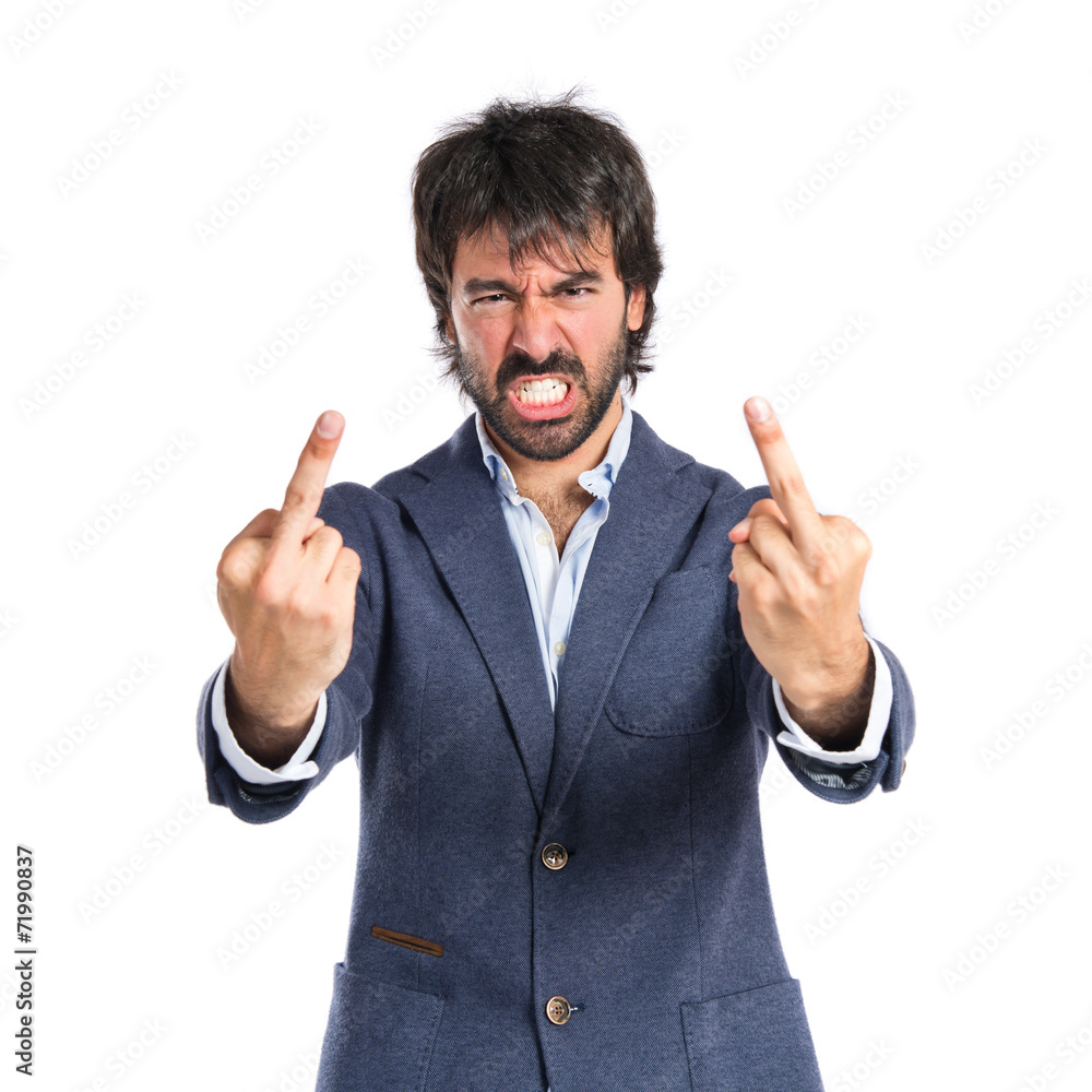 Businessman making horn gesture over white background Businessman making horn gesture over white background