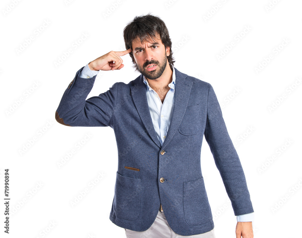 Man making suicide gesture over white background Man making suicide gesture over white background