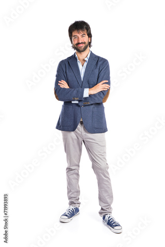 Businessman with his arms crossed over white background