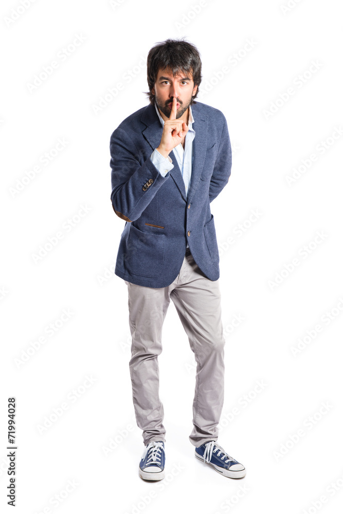 Man making silence gesture over isolated white background Man making silence gesture over isolated white background