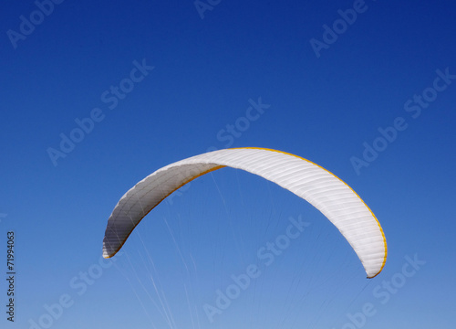 White paraglider  in the sky