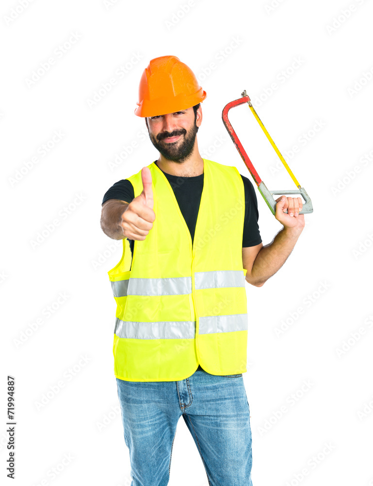 Workman with hacksaw over white background