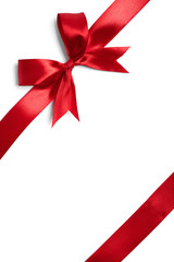 Shiny red satin ribbon on white background