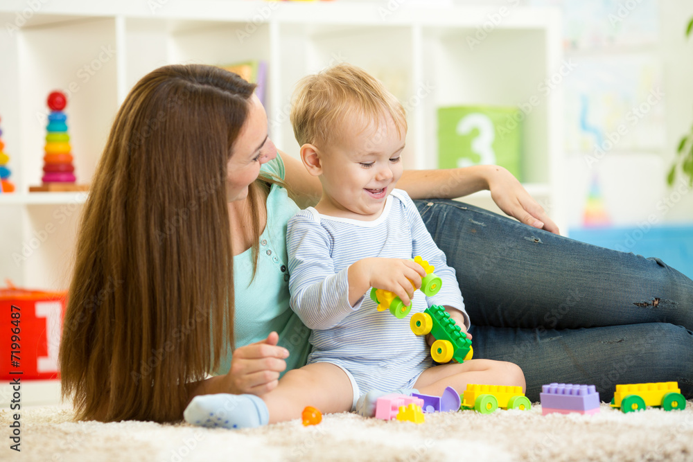 mother and child boy playing together indoor mother and child boy playing together indoor