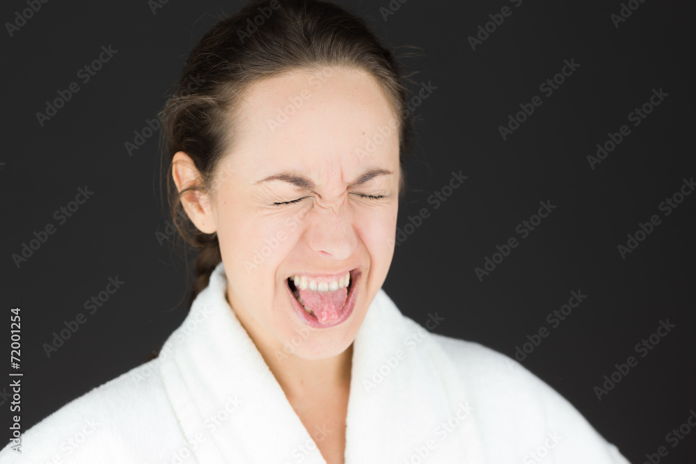 model isolated on plain background face sticking tongue out model isolated on plain background face sticking tongue out