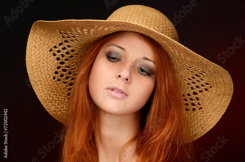 A photo of the beautiful sensual woman with red hair