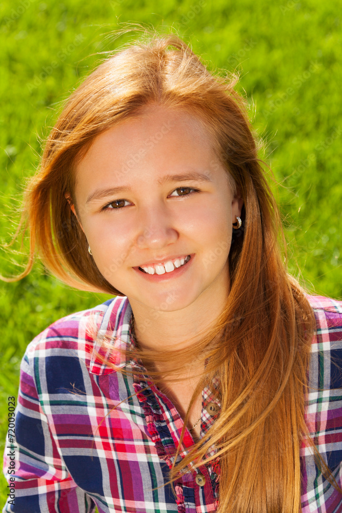 Portrait of young happy girl with long hair