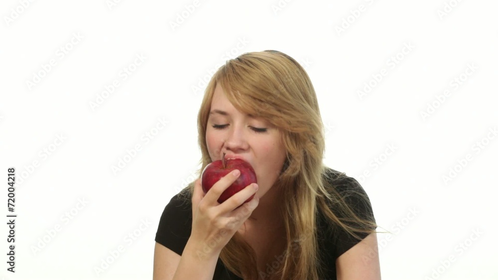 teenager girl eating an apple