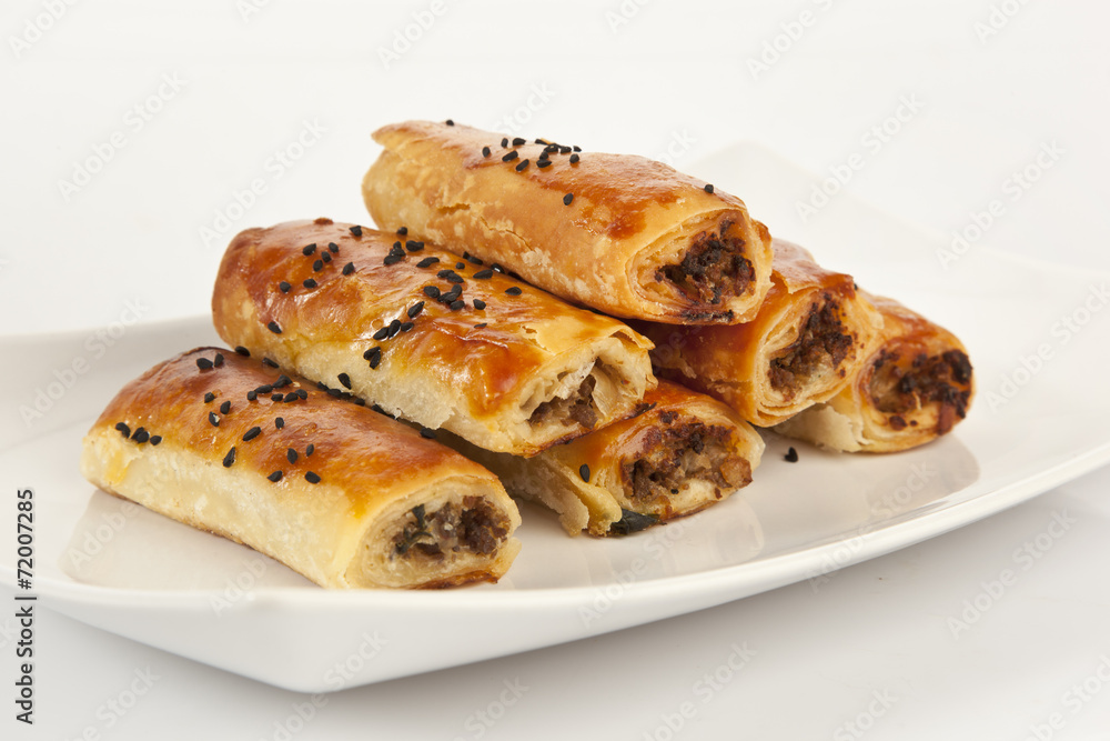 Turkish style meat stuffed filo dough rolls served