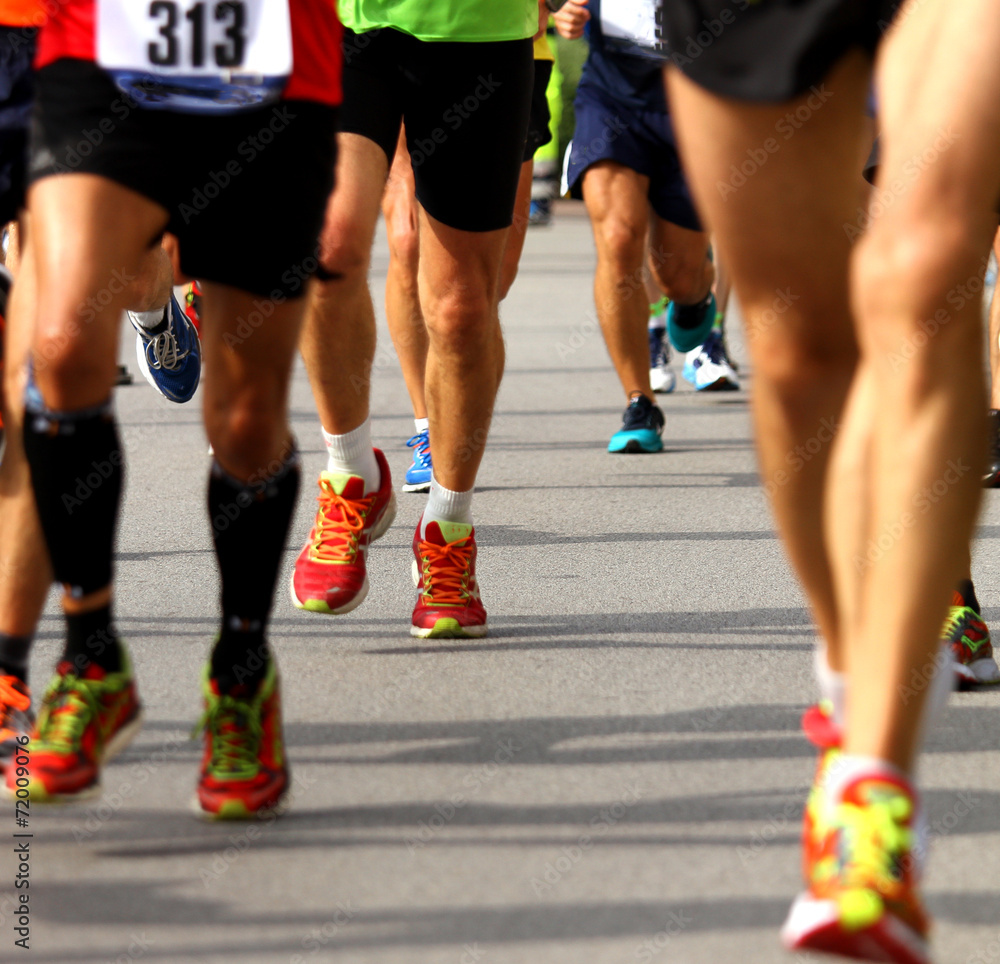 athletic  legs of athletes during the race
