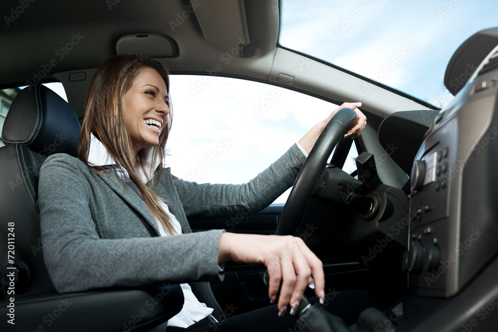 Young smiling woman driving Young smiling woman driving