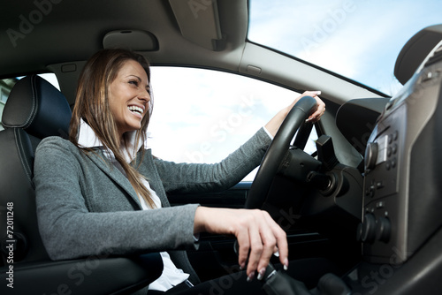Young smiling woman driving © StockPhotoPro