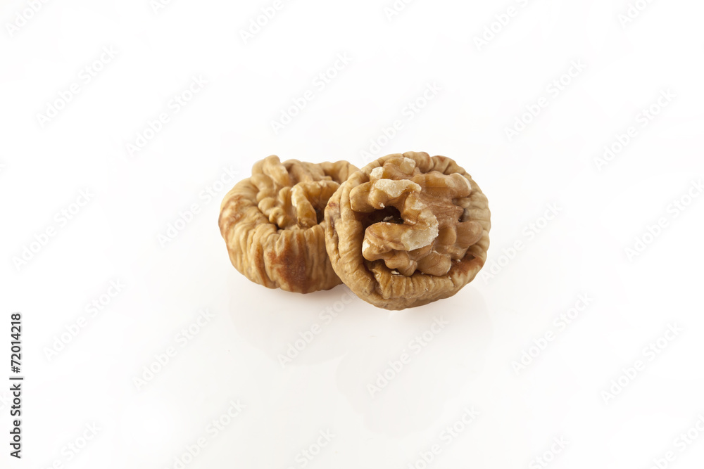 Dried figs with walnuts isolated with clipping path Dried figs with walnuts isolated with clipping path