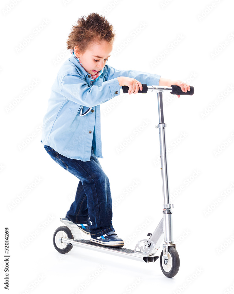 Little boy playing with his scooter Little boy playing with his scooter
