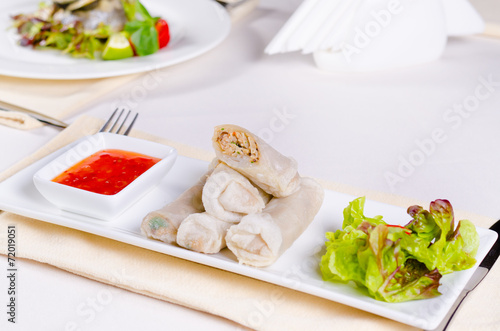 Tasty Sliced Spring Rolls with Lettuce and Sauce