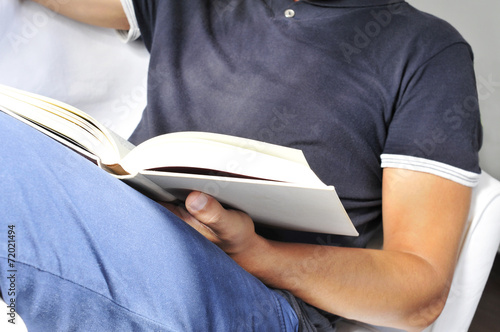 young man reading a book