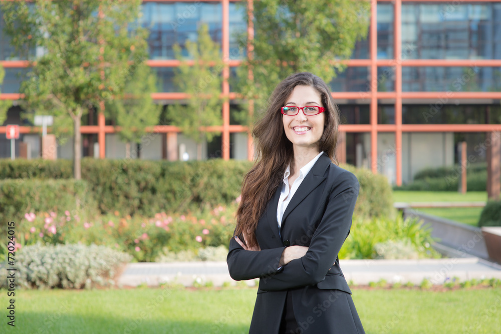 Fototapeta premium Portraig of a young student on a modern building background