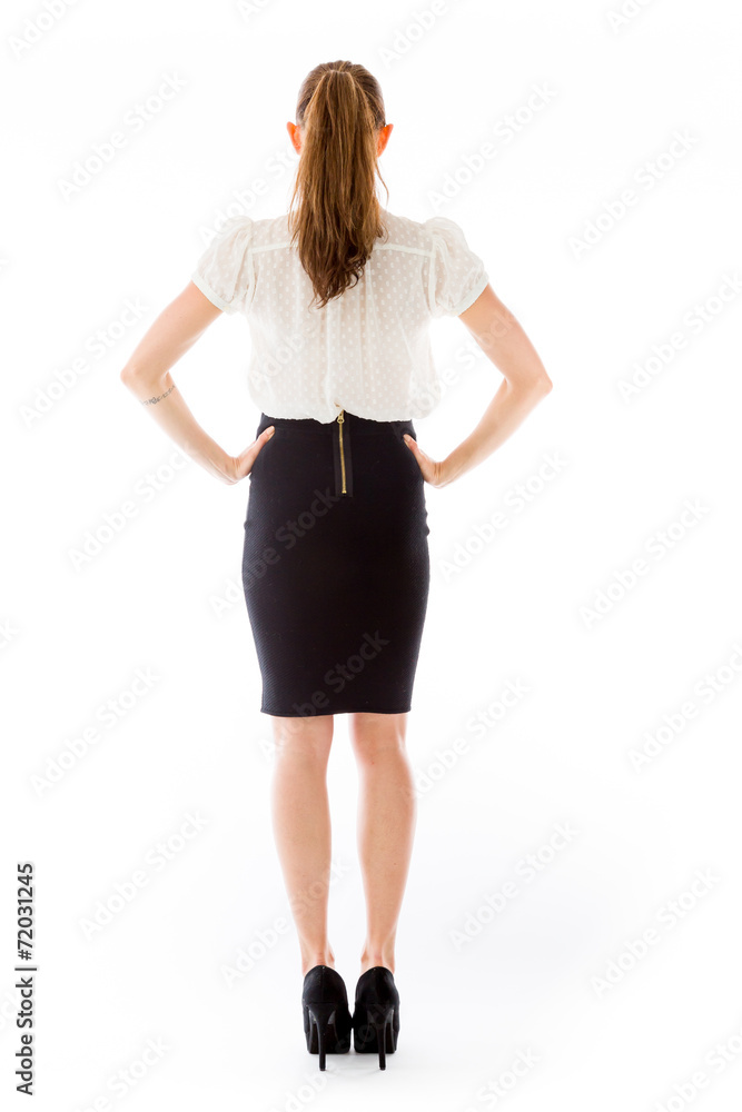 Fototapeta premium model isolated on plain background back hands on hips