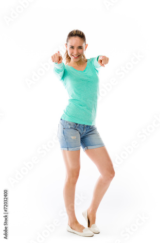 model isolated on plain background fingers pointing to camera