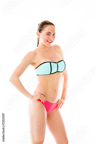 model isolated on plain background pround confident hands on hip