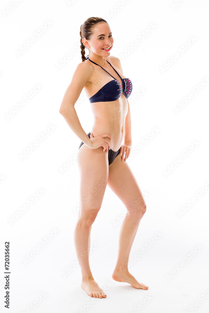 Obraz premium model isolated on plain background pround confident hands on hip