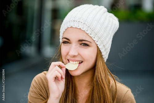 Teenager eating chips