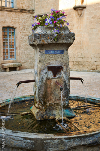 Ancient fountain in Provence photo