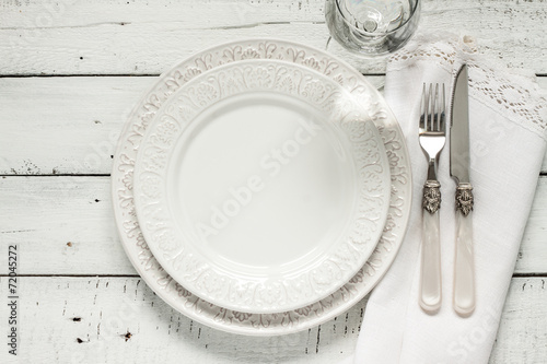 White table setting from above with elegant empty plate