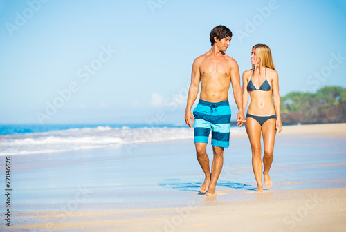 Happy Couple Walking on the Beach