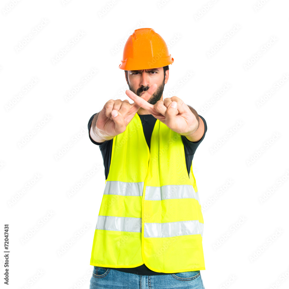 Workman doing NO gesture over white background Workman doing NO gesture over white background