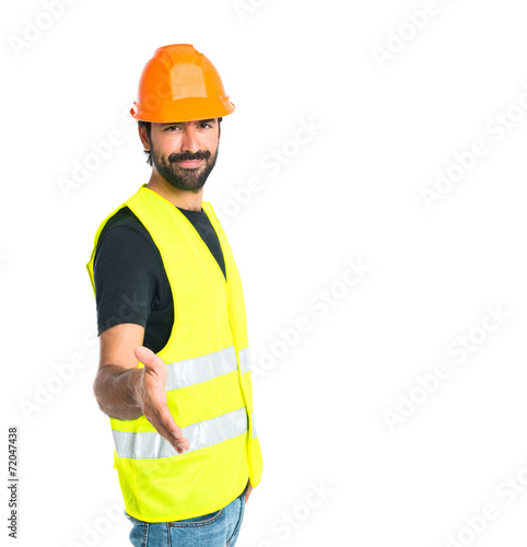 Workman making a deal over isolated white background