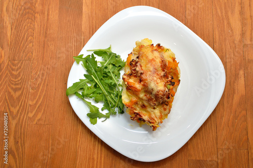 Cod baked with vegetables and cheese