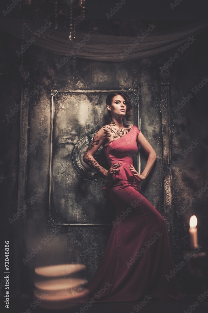 Tattooed beautiful woman in old spooky interior Tattooed beautiful woman in old spooky interior