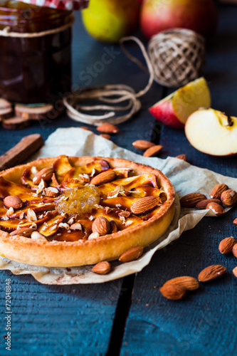 apple tart on a sand base with pear jam and caramel